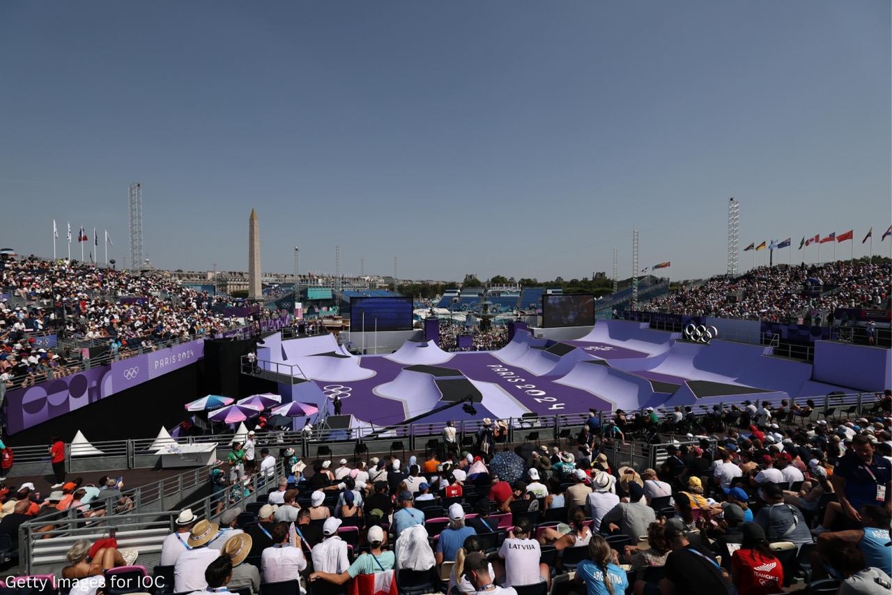 Large crowd watching a purple skatepark at Paris Games 2024