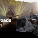 A video camera overlaying an image of a band performing on a stage behind