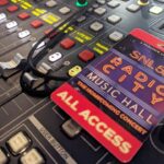 A close-up of a sound board for SNL50