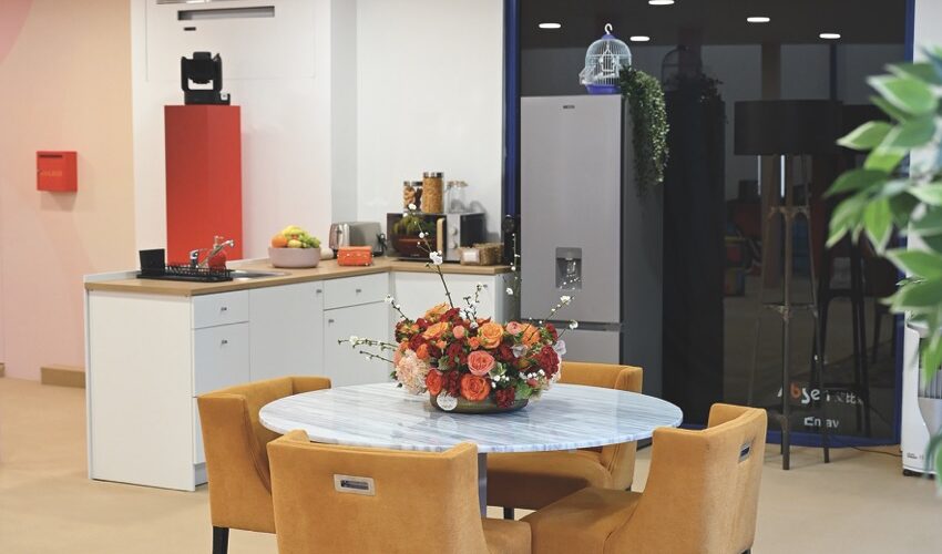 A dining room and kitchen setup with a hidden PTZ camera