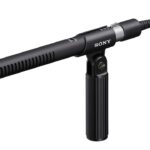 A black shotgun microphone by Sony, against a white background